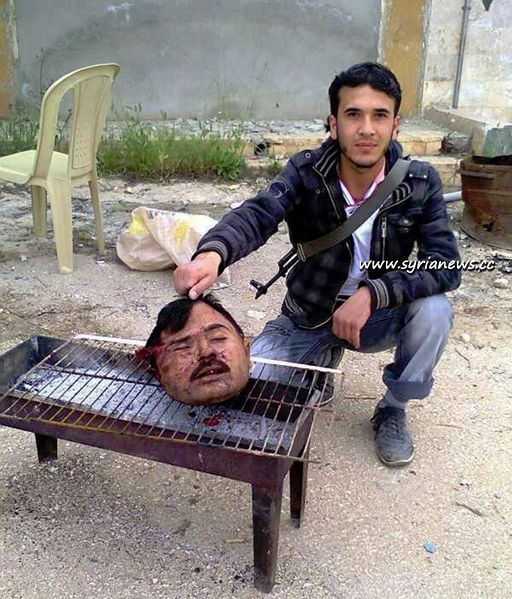 File:Syria rebels behead pilots grill them.jpg