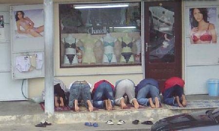 File:Praying in front of chantelle lingerie.jpg
